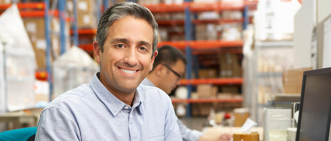 man smiling in warehouse