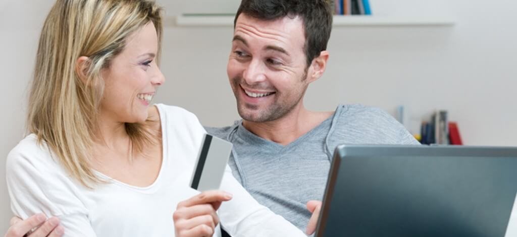 man and woman with credit card
